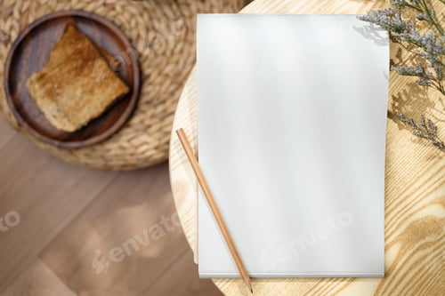 Preview: Mockup notepad with pencil on round table