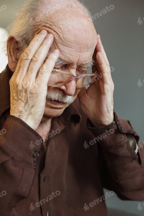 Preview: Close up. Thoughtful portrait of a gray-haired old man. Trying to catch the thought.