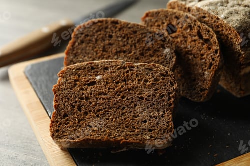 Preview: Board with fresh rye bread, close up