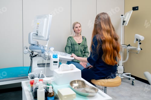 Preview: in the clinic a young blonde girl at an appointment with a gynecologist consultation before the