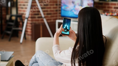Preview: Childish asian person enjoying mobile gaming