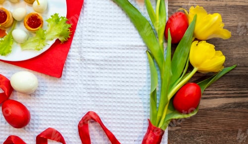 Preview: Easter holiday card with red eggs and yellow tulip flowers on wooden table