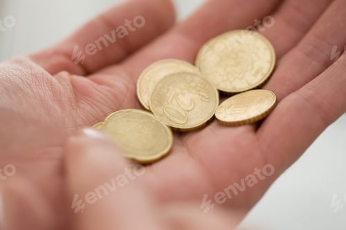 Preview: Close up of woman counting Euro coins