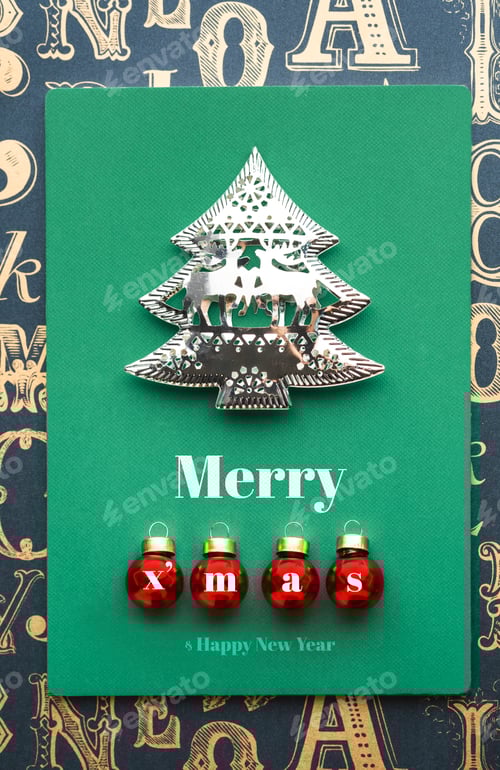 Preview: Merry Christmas and tree and xmas red ball decoration with green notebook on old type pattern