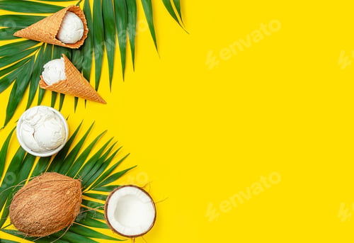 Preview: Coconut ice cream with palm leaves on yellow background. Top view, copy space.