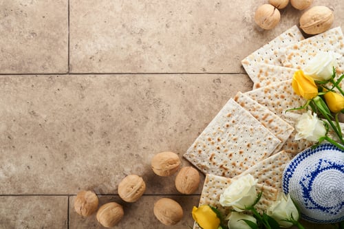 Preview: Passover celebration concept. Matzah, kosher red wine, walnut and white and yellow roses. Traditiona