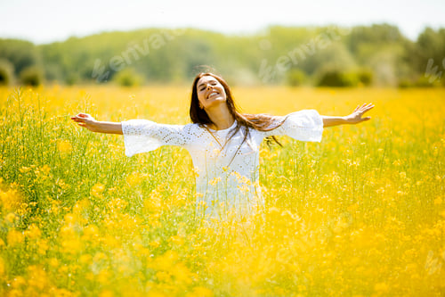 Preview: Young woman in the rapeseed field