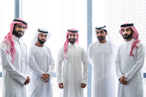 Preview: Arab businessmen wearing emirati and saudi kandura meeting in office