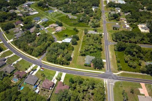 Preview: Aerial view of street traffic with driving cars in small town