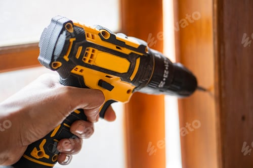 Preview: Using Black and Yellow Power Drill on Wood
