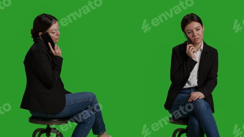 Preview: Close up of office worker talking on smartphone call over greenscreen