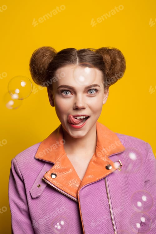 Preview: Girl licking lips staring wearing pink jacket