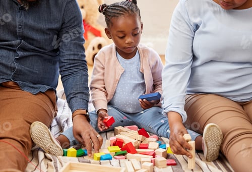 Child Plays with Parents and Colorful Building Blocks