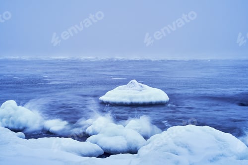 Preview: Winter landscape featuring floating ice and sea waves