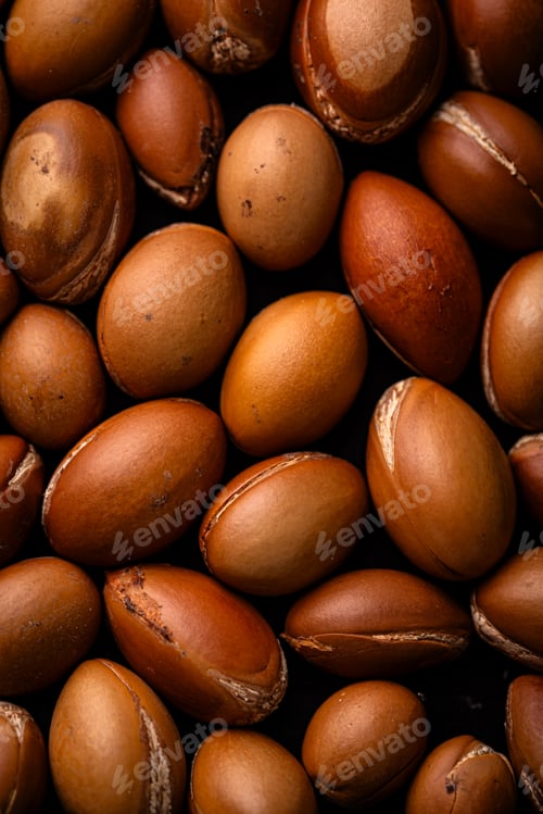 Preview: Close-up of brown macadamia nuts background