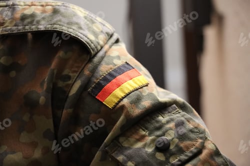 Preview: Green and brown camouflage jacket with a flag of Germany patch