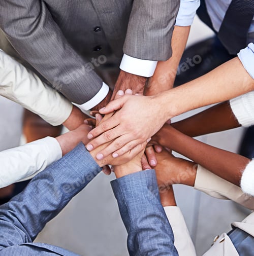 Preview: Cropped shot of a group of businesspeople standing in a huddle with their hands piled up
