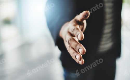 Preview: Closeup shot of an unrecognizable businessman extending a handshake in an office