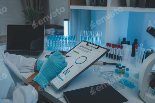 Preview: A scientist is reviewing lab results and documents receives from researchers involved in chemical te