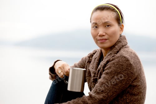 Preview: Portrait of woman by lake.