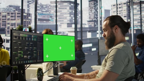 Preview: Zoom in on mockup PC monitor used by IT expert in office
