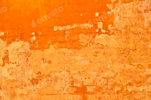 Preview: bright and vibrant orange coloured finery, plastering part of a wall, old and vintage, weathered