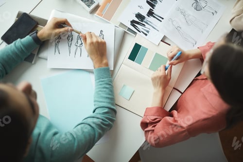 Preview: People working with sketches at office