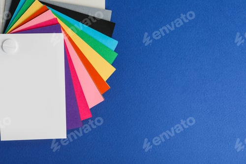 Preview: Color palette on blue background, top view. Space for text