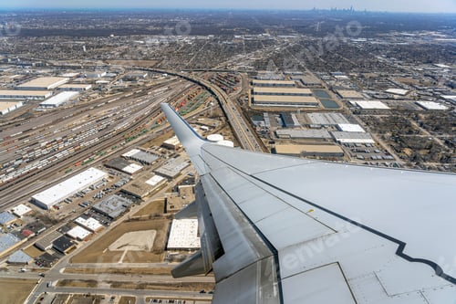 Preview: Aerial view of cargo trains and contrainers at the terminal railway which look through airplane