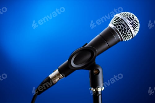 Preview: Microphone on stage against a background blue recording studio
