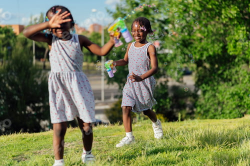 Preview: Two girls blowing bubbles