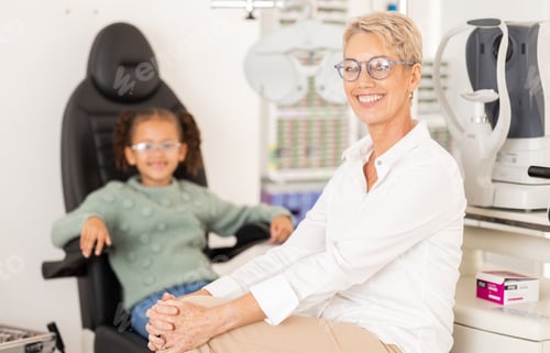 Preview: Ophthalmologist, child patient and vision test or eye exam for eye care to check and examine eyesig
