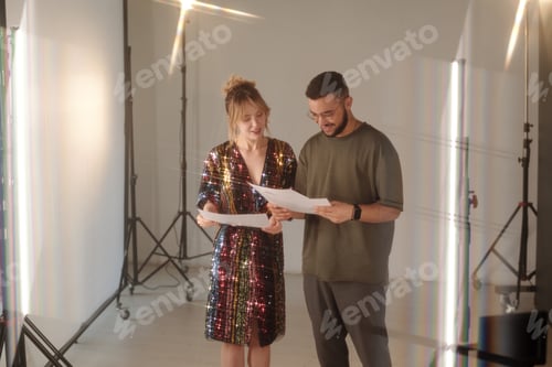 Preview: Smiling Woman Consulting with Director Backstage