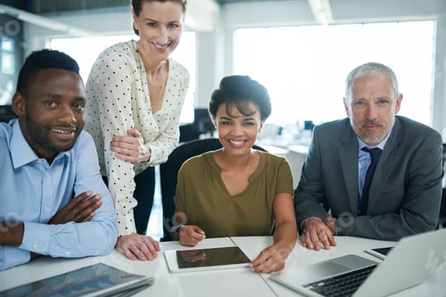 Preview: Portrait of a group of businesspeople sitting together in an office