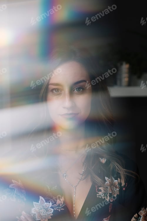 Preview: Portrait of woman behind windowpane