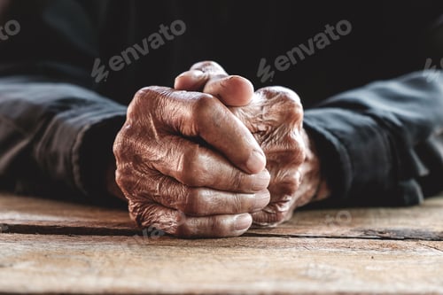 Preview: Close up of male wrinkled hands, old man is wearing