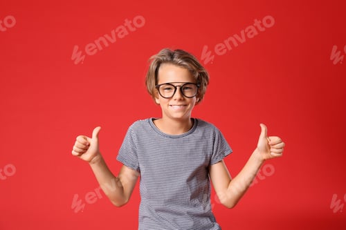 Preview: Cheerful Child Giving a Double Thumbs-Up on Red