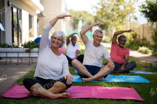 Preview: Senior people exercising with hands raised