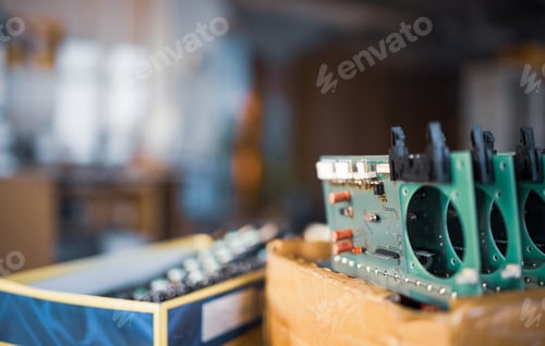 Preview: Close-up electric green embedded microcircuits in production