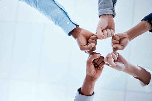 Preview: Business people, fist circle and teamwork in low angle, team building and trust in office. Solidari
