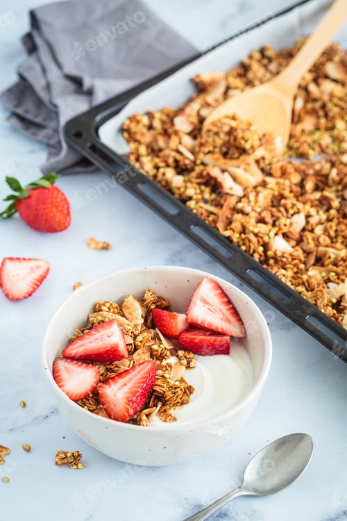 Preview: Homemade green buckwheat and nuts granola with coconut yogurt and strawberries.