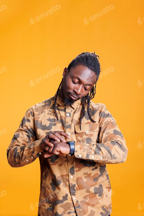 Preview: Person checking time on wristwatch