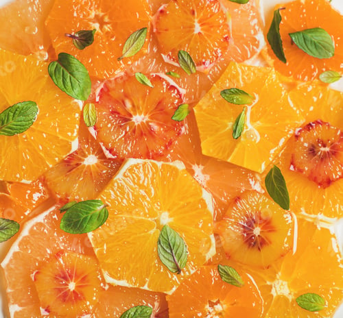 Preview: Fresh citrus fruit salad with mint and honey, close-up