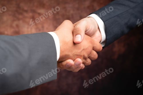 Preview: Two Professional Well-Dressed Corporate Businessmen Handshake Indoors
