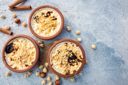 Preview: Baked rice pudding turkish milky dessert sutlac in earthenware casserole with hazelnuts