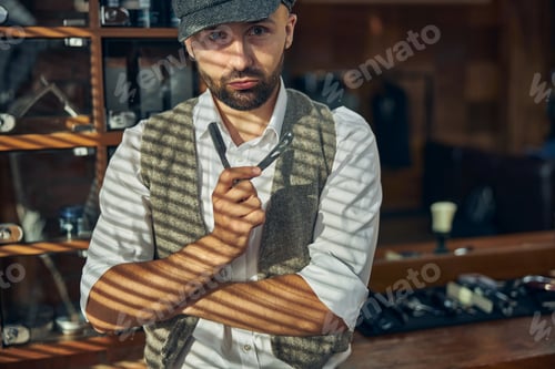 Preview: Professional barber posing with a straight razor