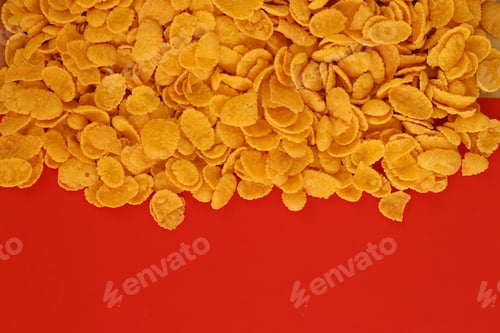 Preview: Background of breakfast cereals in big amount on red background, top view