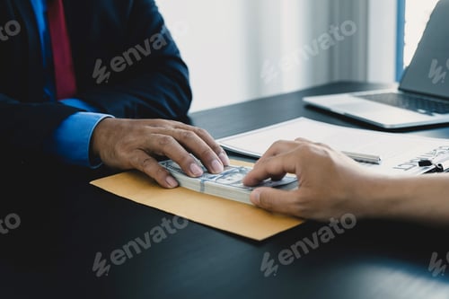 Preview: Businessman hand holding dollar bank note money to bribe financial officials