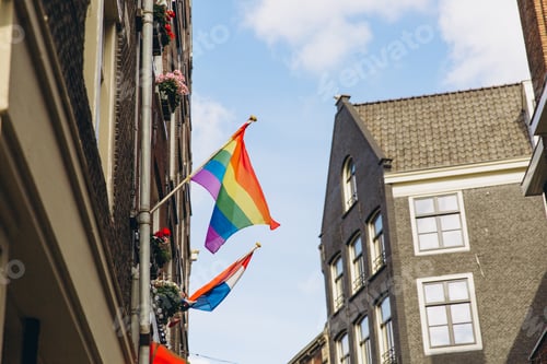 Preview: Gay flag in Amsterdam. Gay rainbow flag on a building.