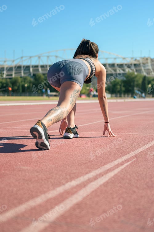 Preview: Fitness runner woman on running track working out